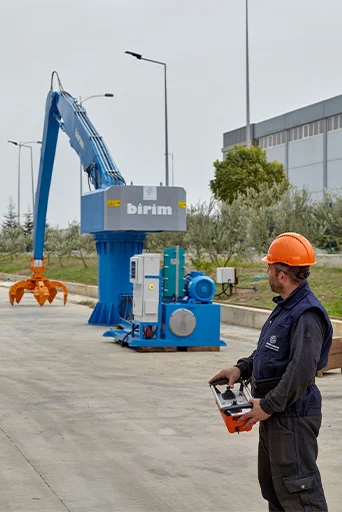 furnace feeder material handler with operator